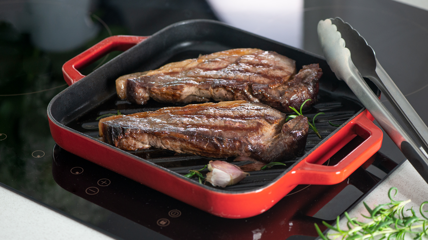 Sirloin steak cooking on a ProCook Red Cast Iron Griddle