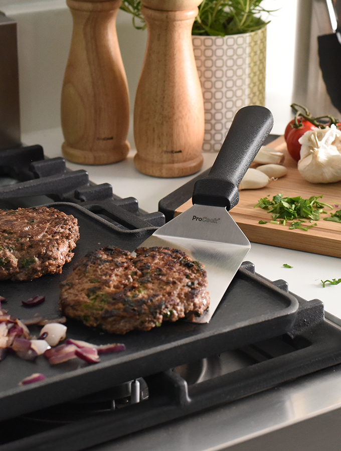 ProCook Grilling Spatula turning burger on a griddle